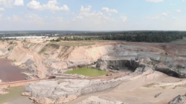 Excavators, bulldozers and heavy machinery working at clay iron ore quarry