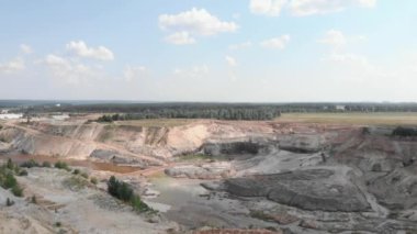 Giant Iron ore open quarry. Large clay pit mining. Lakes in red clay quarry. Industrial