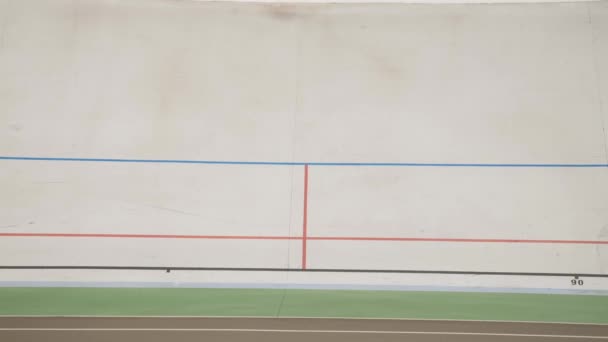 Professional cyclists riding fast on velodrome. Training on cycling track — Stock Video