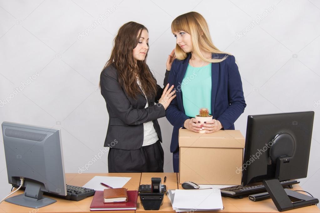 Office worker comforting colleague Dismissed
