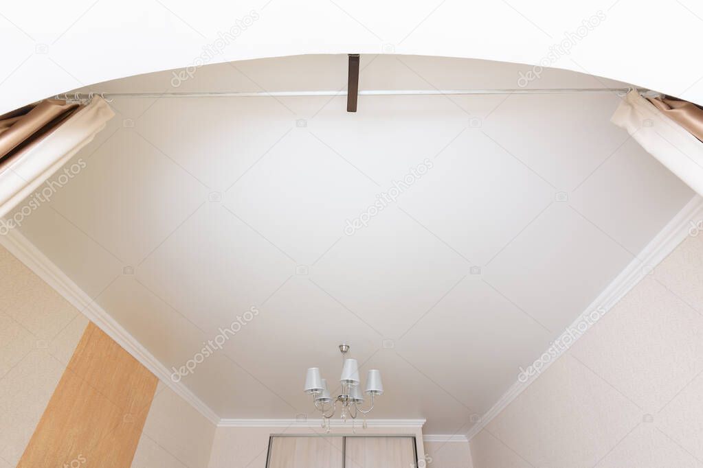 Classic white matte ceiling in the bedroom