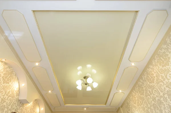 Beautiful original rich multi-level stretch ceiling in the interior of the room