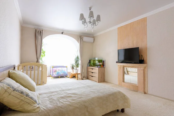 Interior of a spacious bedroom with furniture and a nice light design