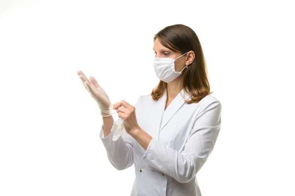 Girl Doctor Puts Transparent Medical Gloves Her Hands — Stock Photo, Image