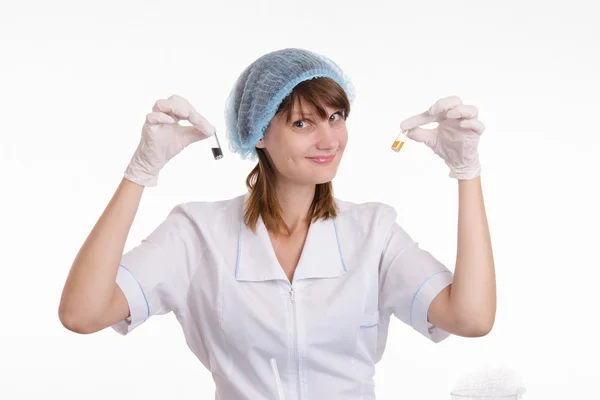 Chemistry teacher with powders in vials — Stock Photo, Image