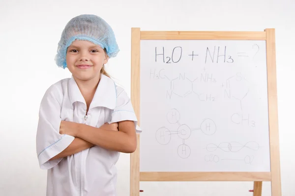 Portrait of a Girl chemist at the blackboard — Stock Photo, Image
