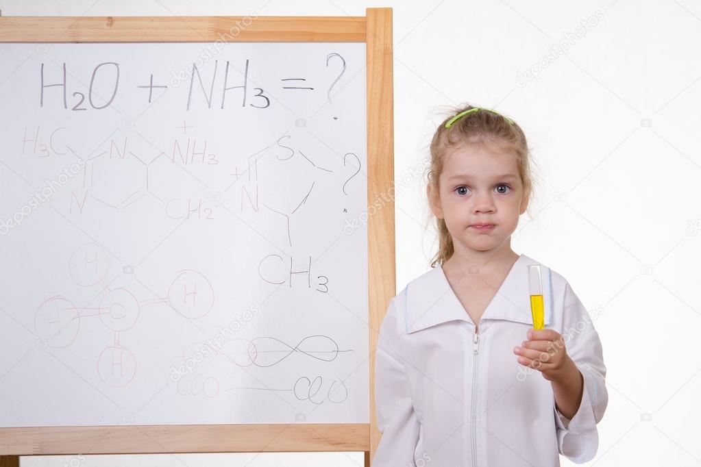 Chemist with test tube at the blackboard