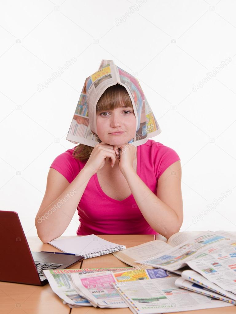 The girl wore a newspaper as headscarf