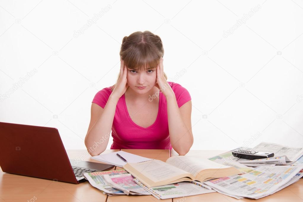 The girl has a headache from job search