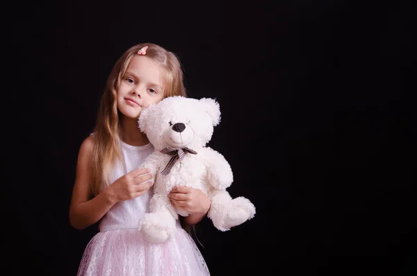 Portrait of happy girl with a soft bear — Stock Photo, Image