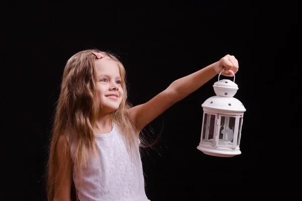 Five-year girl shines candlestick — Stock Photo, Image