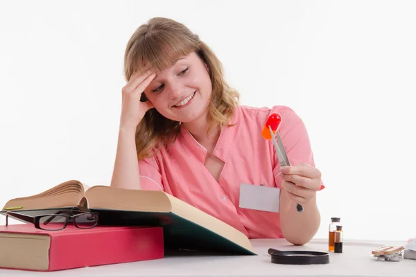 Medical student happily looking at pill — Stock Photo, Image