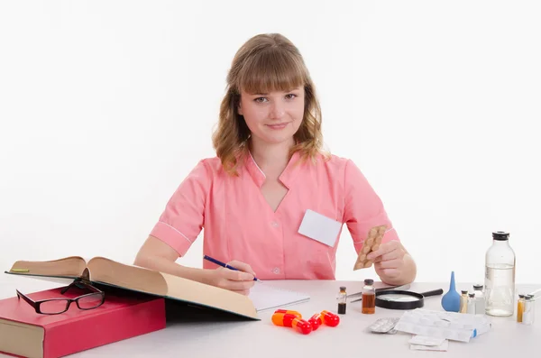 Pharmacist with a pack of pills in package — Stock Photo, Image