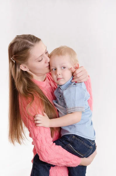 Mum holds on hands of three sons — Stock Photo, Image