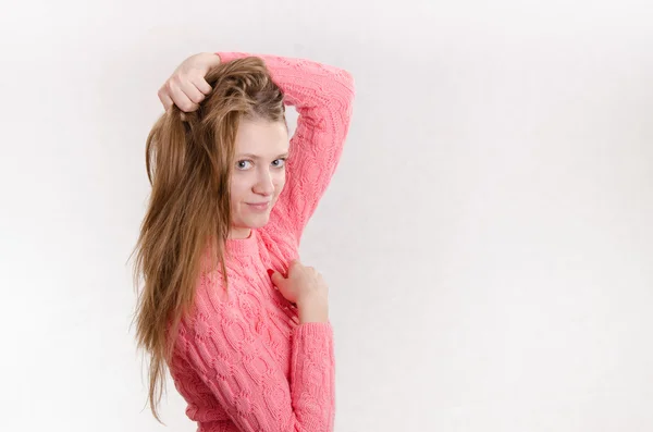 Cheerful girl holding a hand through his hair — Stock Photo, Image