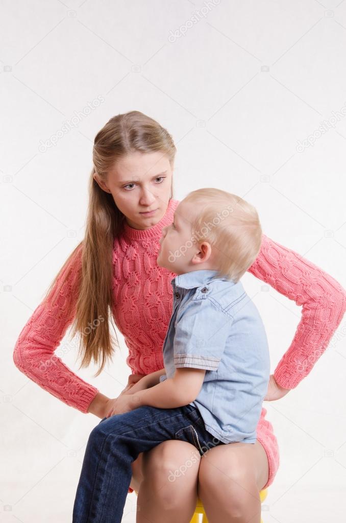 Young mother is angry at three year old bo