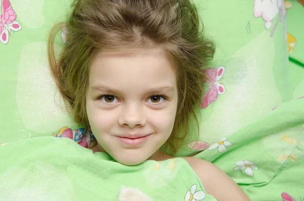 Girl lying in bed — Stock Photo, Image