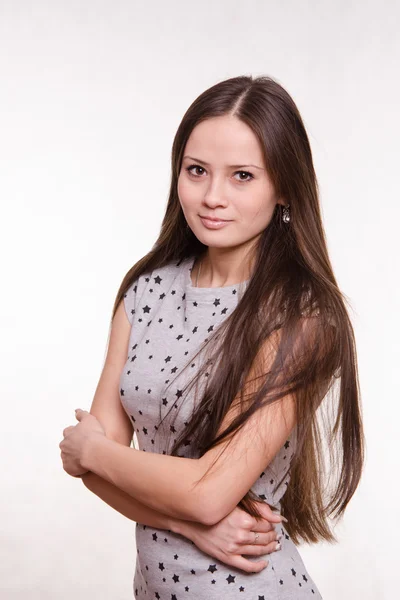 Menina abraçando seus braços — Fotografia de Stock