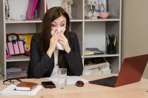 The girl wiping nose with a tissue in the office — Stock Photo, Image