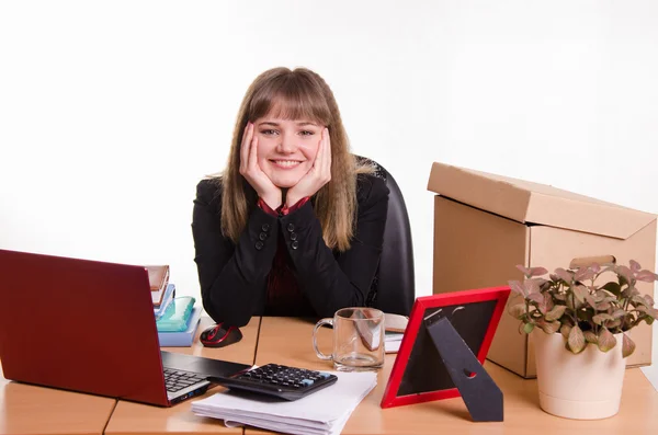 Pretty teenage girl sitting at office desk — Stock Photo, Image