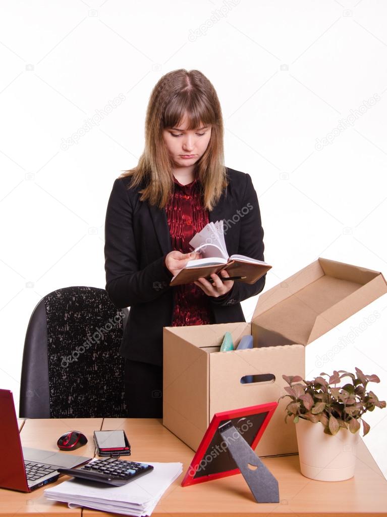 Dismissed girl in office goes through personal belongings