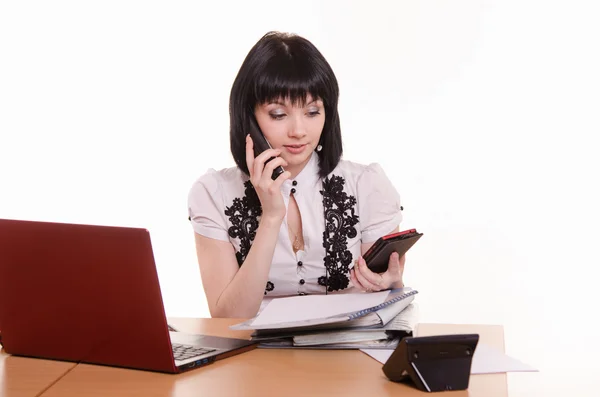 Call-center worker talking on phone and looking at the other — Stock Photo, Image