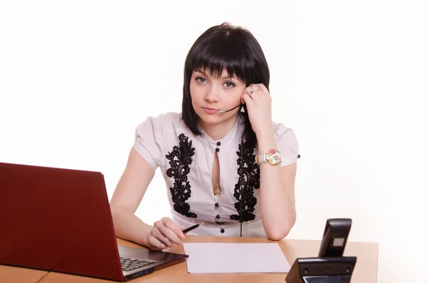 Serious call-center employee at the desk — Stock Photo, Image