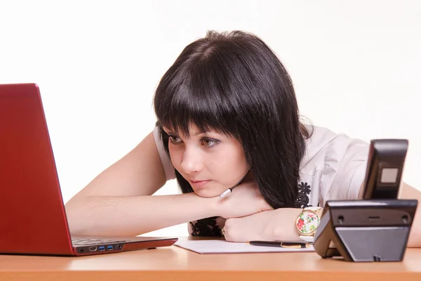 Tired call-center employee looking at the monitor — Stock Photo, Image