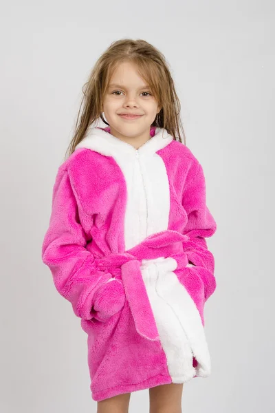 Portrait of six-year girl in a pink bathrobe — Stock Photo, Image