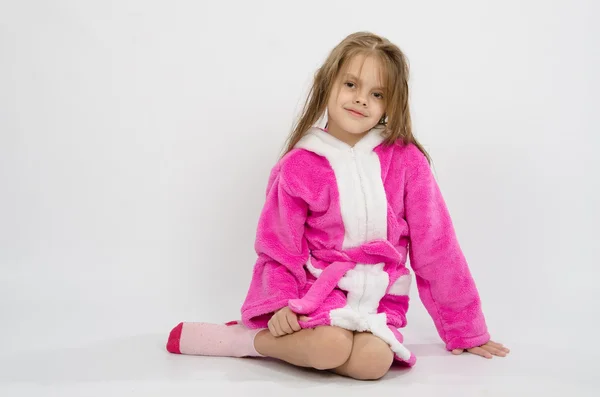 Six year old girl in a bathrobe — Stock Photo, Image