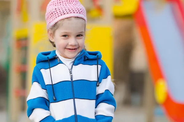 Portrait of cheerful four-year girl in playground — Stock Photo, Image