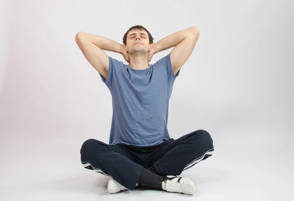 Athlete stretches the muscles of back — Stock Photo, Image