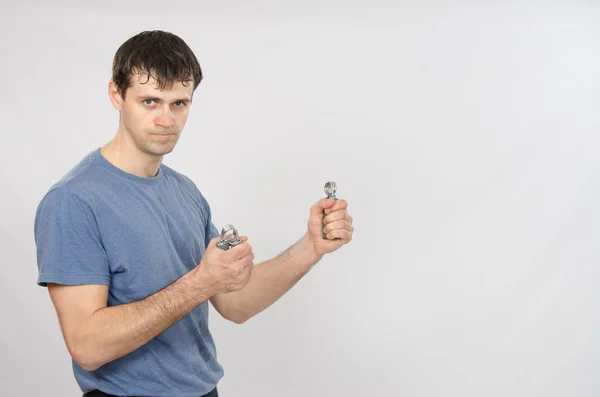 Athletes train arm muscles with expanders — Stock Photo, Image