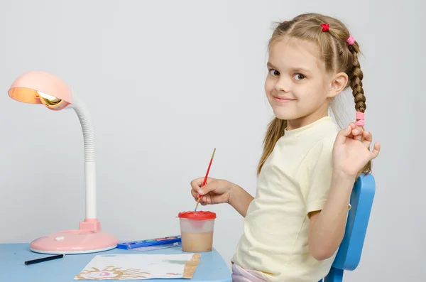 Six year old girl draws paints and waves — Stock Photo, Image