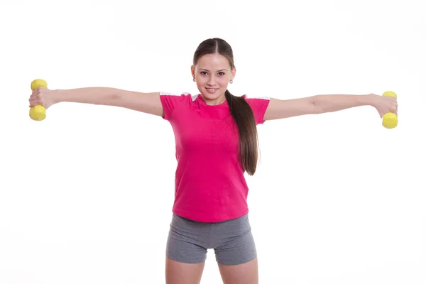 Femeia sportivă a întins ambele brațe cu gantere — Fotografie, imagine de stoc