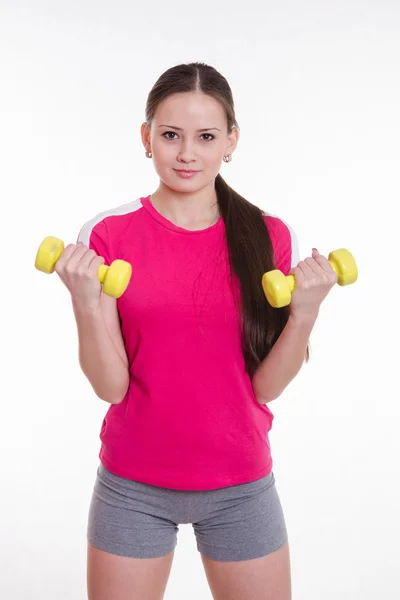 The athlete pumps weights both hands Stock Photo