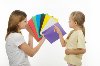 The child learns to identify colors clipart