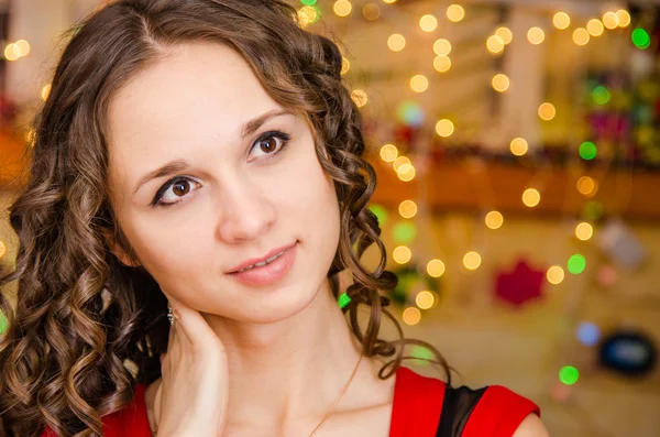 Portrait of girl on a background blurred lights — Stock fotografie