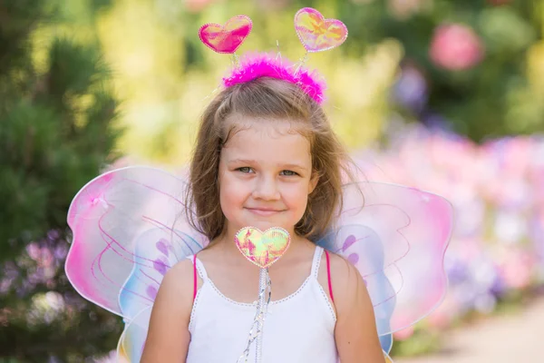 Portrait of a fairy with a magic wand — Stock Photo, Image