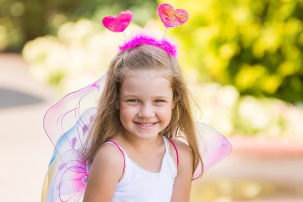 Happy four-year girl playing in fairy — Stock Photo, Image