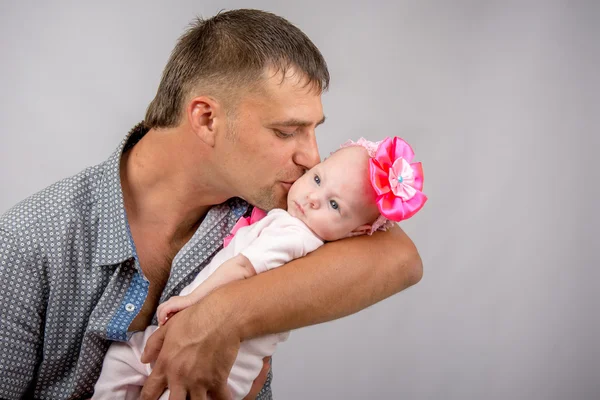 Happy dad kissing a two-month baby daughter — Stock Photo, Image