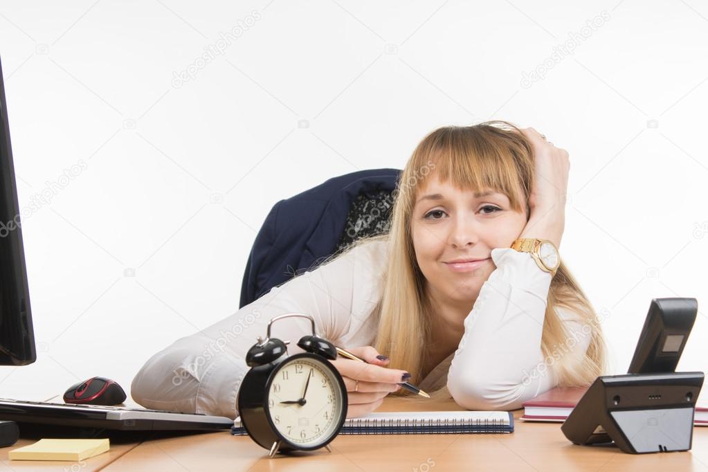 Tired office employee tries to schedule the working day