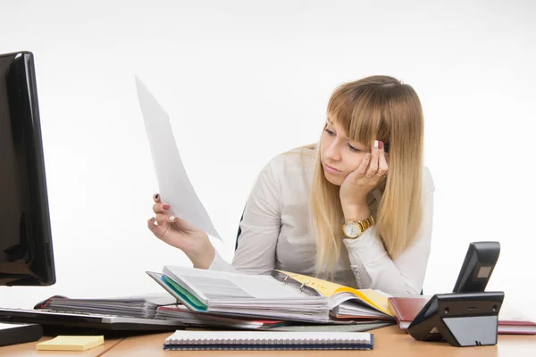 Tired office of a specialist reading the paper document — Stock Photo, Image