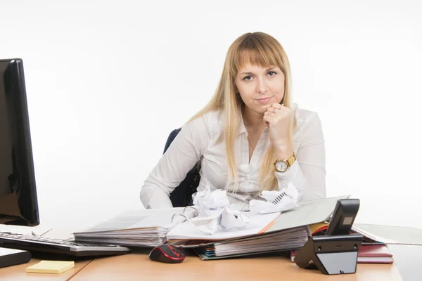 Office Specialist nervously squeezed a few papers and evil looks in the frame Stock Picture