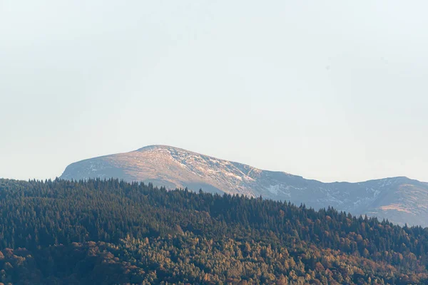 clear blue air over mountains in bulgaria crops hay fields clouds blue sharp focus distance superzoom copy space for text long lens minimal landscape rural