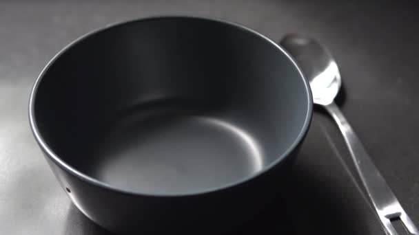 A scene of breakfast cereal in a bowl in slow motion — Stock Video