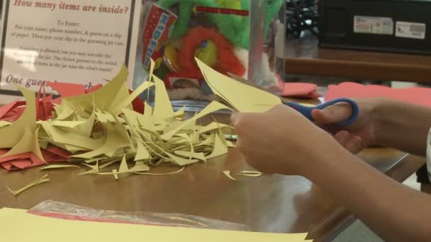 Child cutting out construction paper(1 of 2) — Stock Video