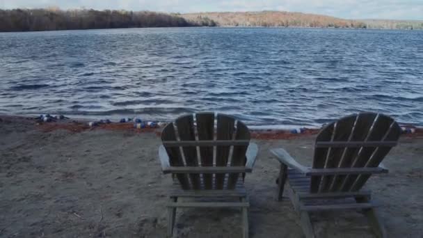 Lounge chairs on the shore — Stock Video