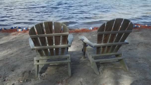 Lounge chairs on the shore — Stock Video