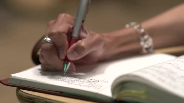 Close-up of professional woman taking notes (2 of 2) — Stock Video